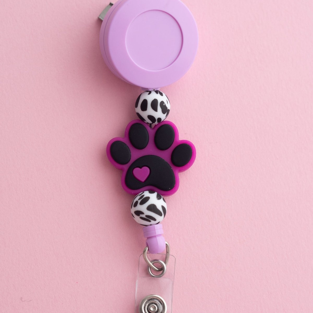 Shop the Image Spotted Paw Badge Reel from Cara & Co Craft Supply