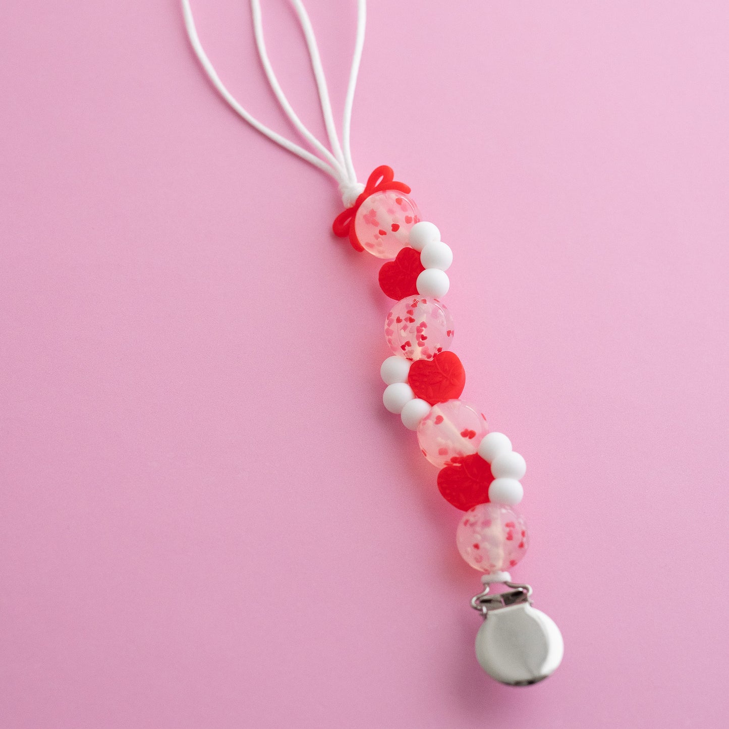 Shop the Image Sweetheart Sprinkles Pacifier Clip made with Silicone Beads from Cara & Co Craft Supply