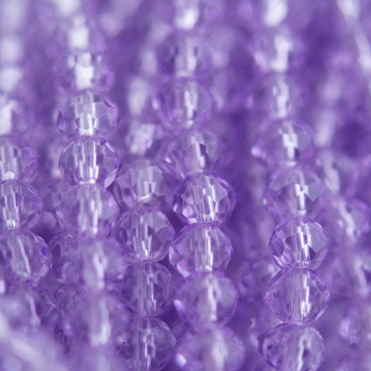 Glass Beads Glass Faceted Rondelle Clear Purple from Cara & Co Craft Supply