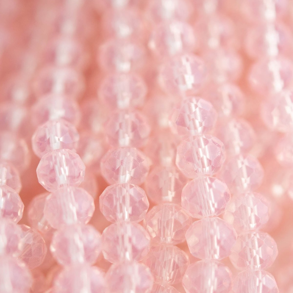 Glass Beads Glass Faceted Rondelle Frosted Pink from Cara & Co Craft Supply