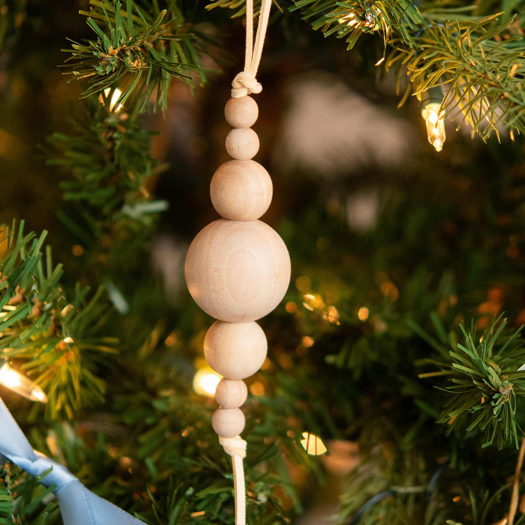 Wood Icicle Christmas Ornament using wood round beads from Cara & Co Craft supply