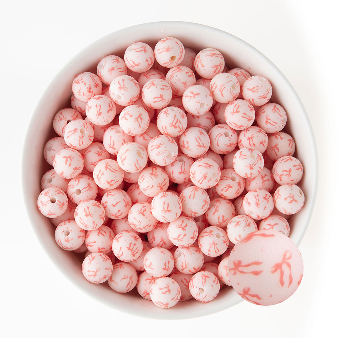 12mm Silicone Round Print Beads Tied with a Bow from Cara & Co Craft Supply