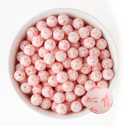 12mm Silicone Round Print Beads Tied with a Bow from Cara & Co Craft Supply