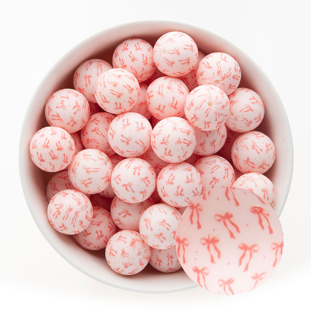 Silicone Print Beads Exclusive - 19mm Round Tied with a Bow from Cara & Co Craft Supply