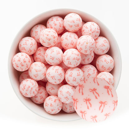 19mm Silicone Round Print Beads Tied with a Bow from Cara & Co Craft Supply