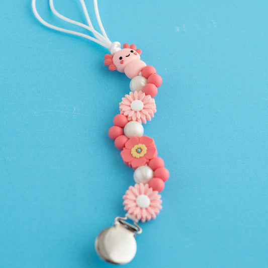 Shop The Image Pink Petal Axolotl Pacifier Clip made with silicone beads