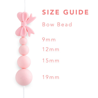 Silicone Focal Beads Bows White from Cara & Co Craft Supply