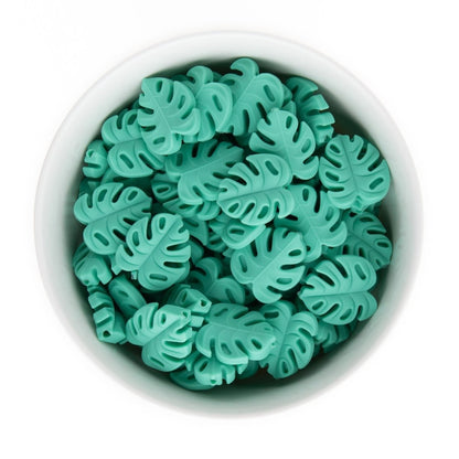 Silicone Focal Beads Monstera Leaves Tropical Teal from Cara & Co Craft Supply